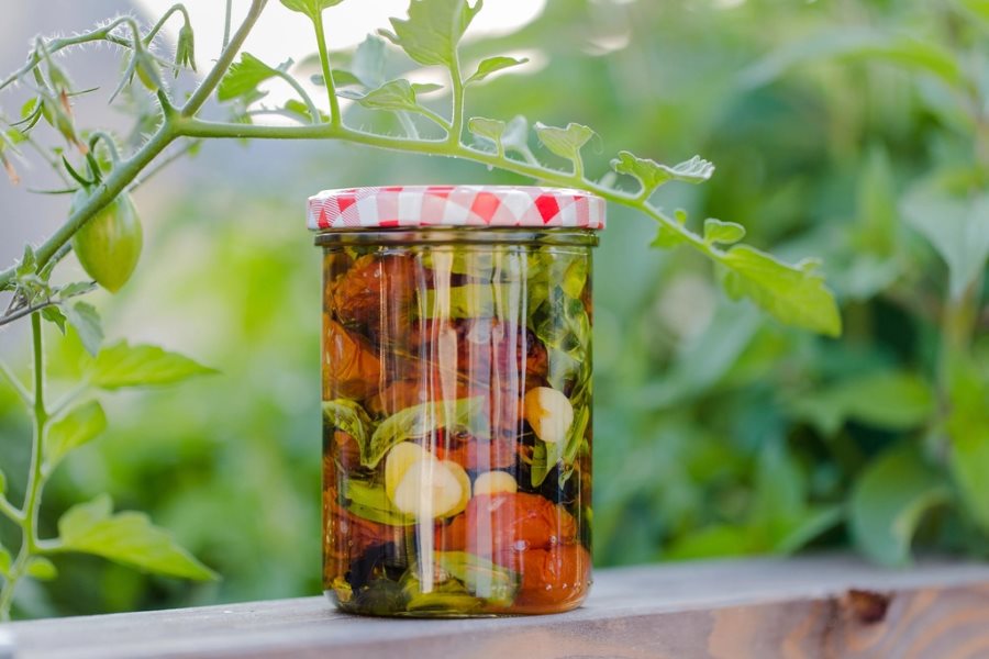 Mixed vegetable pickle preserved in a sealed glass jar