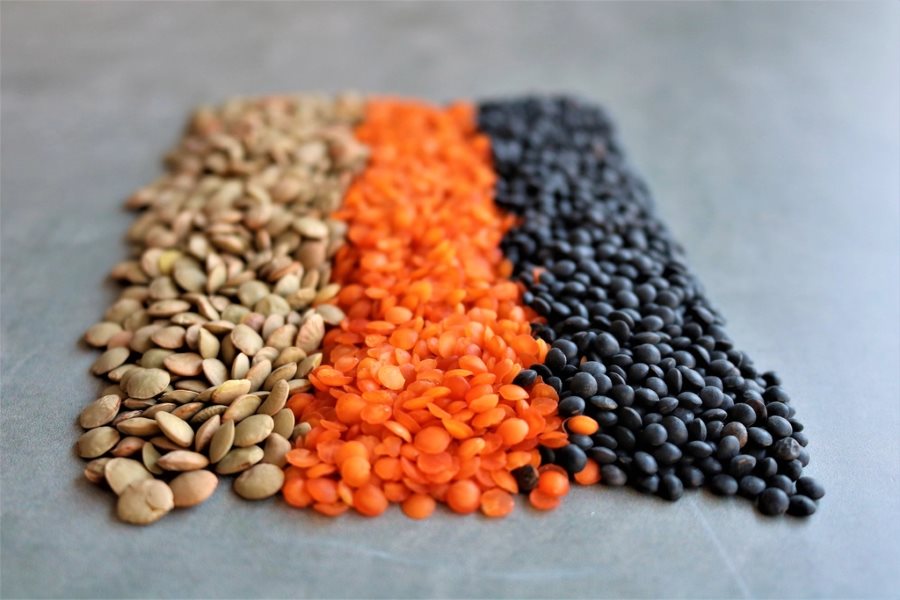 Green, red and black Indian lentils arranged side by side