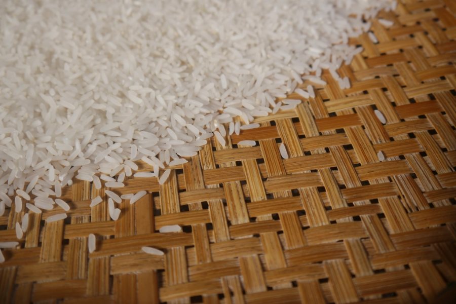 Long grain Indian rice spread on a woven mat